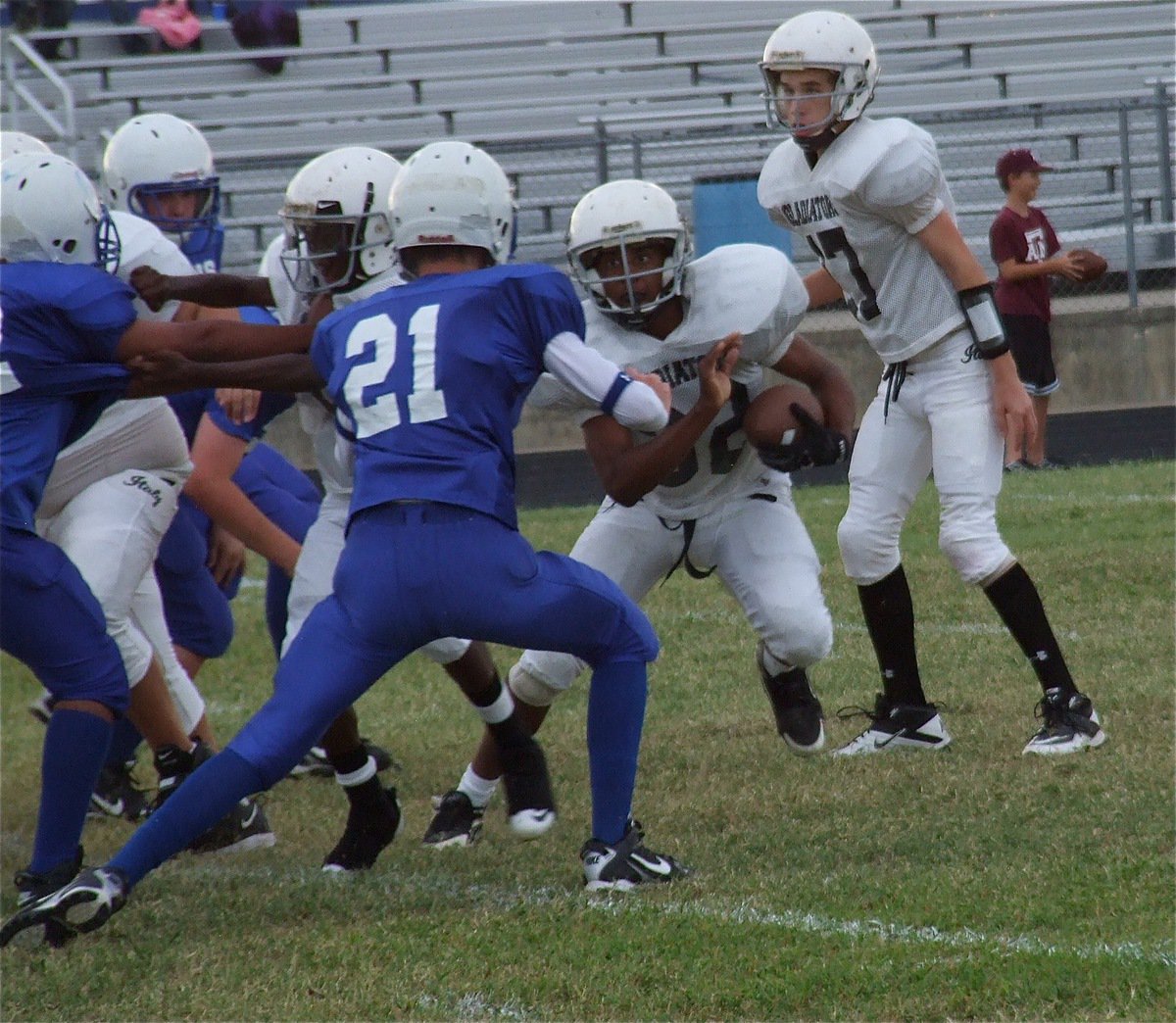 Image: Jaray Anderson(32) tries to juke a Lion defender.