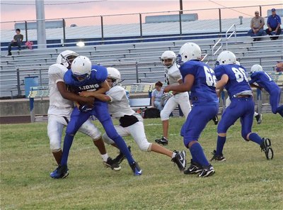 Image: Italy’s defense forces Blooming Grove to fumble the ball.