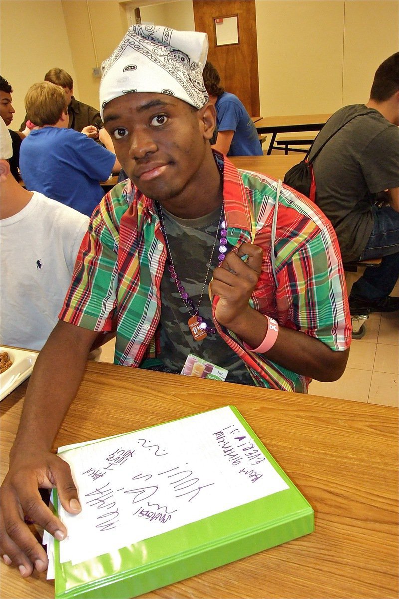 Image: Paul Harris and his camo-plaid shirt with non matching bandana is what Tacky Day is all about.