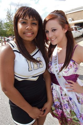 Image: IHS Cheerleader Ashley Harper and Homecoming Princess Haylee Love pose before the parade.