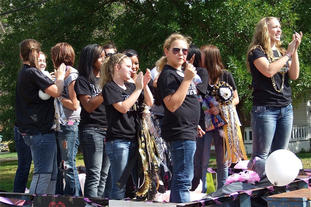 Image: Lady Gladiator Volleyball team members help pump up the Gladiator faithful.