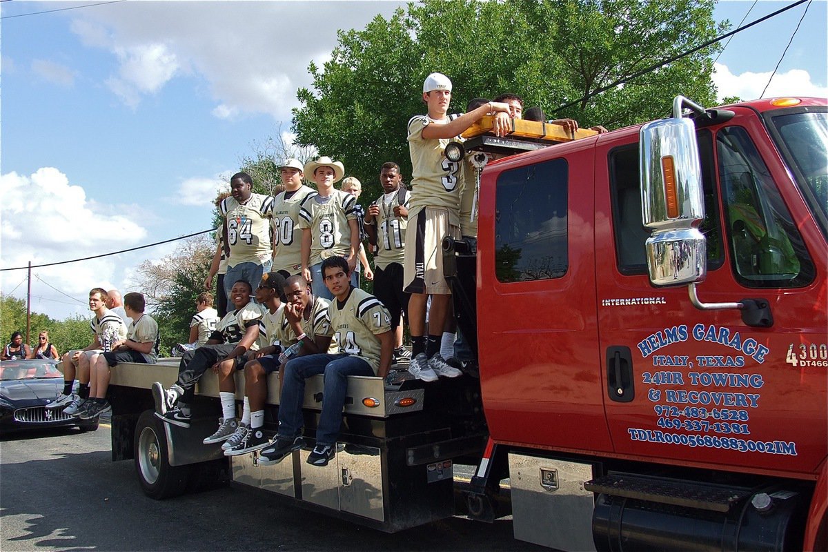 Image: The Gladiators show their pride during the homecoming parade before their matchup against the Blooming Grove Lions.