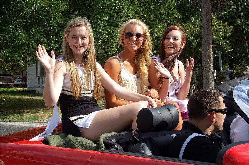 Image: Homecoming Princesses Kelsey Nelson, Sierra Harris and Haylee Love are all smiles during the parade.