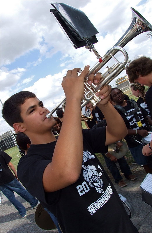 Image: Gladiator Regiment Marching Band member Reid Jacinto gets ready to make some noise during the homecoming parade.