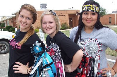 Image: Paige Westbrook, Jesica Wilkins and Monserrat Figueroa show off their homecoming mums and gorgeous smiles.