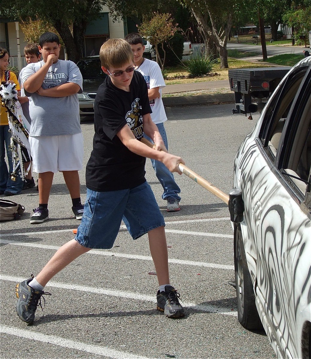 Image: Jr. High Gladiator Hunter Ballard released the beast during the Car Bash.