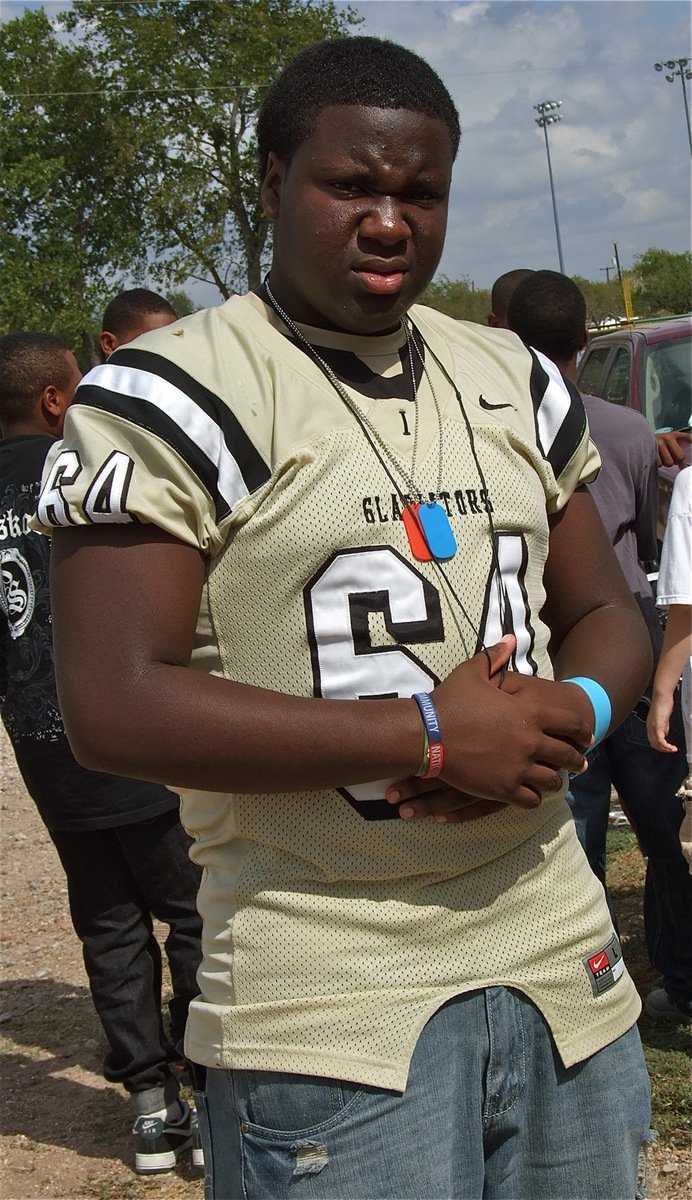 Image: Gladiator lineman Adrian Reed(64) is ready for the homecoming parade.