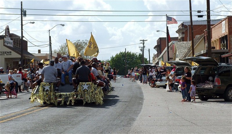 Image: The homecoming parade passes thru downtown Italy.
