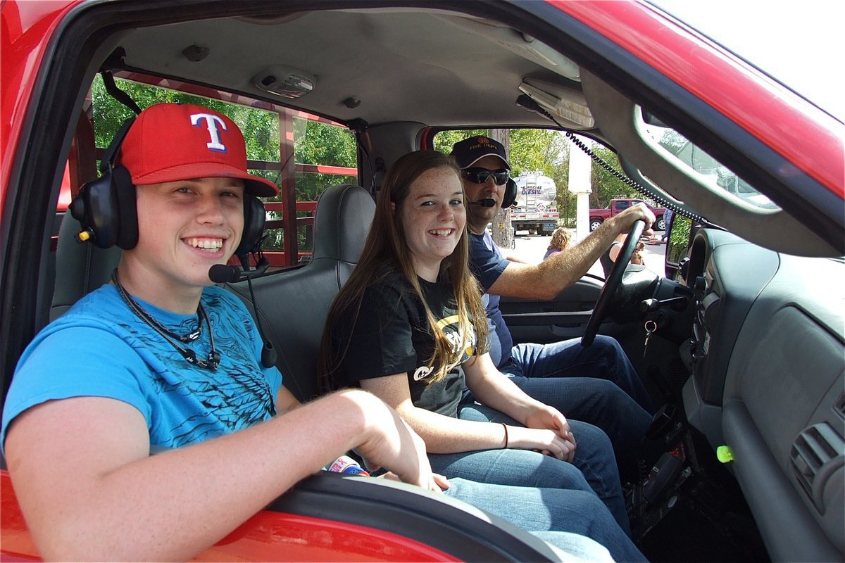 Image: Justin Buchanan, Reagan Cockerham and Paul Cockerham represent IHS and the Italy Fire Department during the homecoming parade.