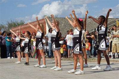 Image: IYAA C-Team Cheerleaders show their skills in front of the Gladiator faithful.