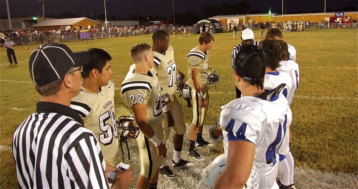 Image: Gladiator captains Omar Estrada(56), Kyle Jackson(28), Larry Mayberry, Jr.(77) and Jase Holden(3) meet the Lions at midfield for the coin flip.