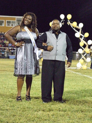 Image: Jimesha Reed and her escort, Jimmy Reed.