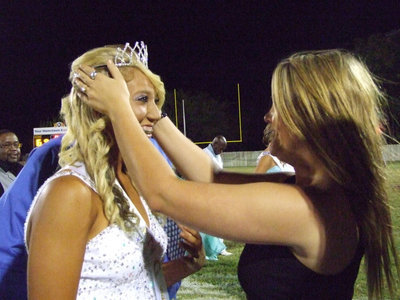 Image: 2010 IHS Homecoming Queen Shelbi Gilley returns to the field to crown Megan Richards.