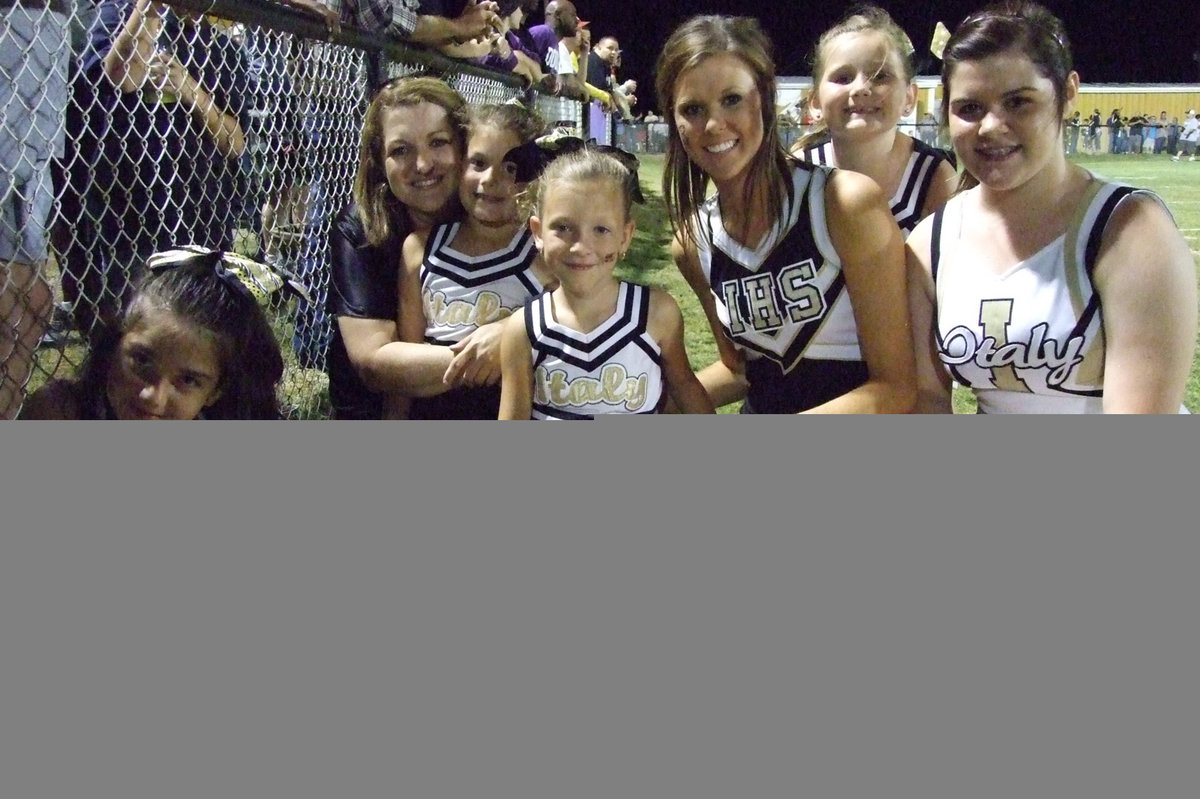 Image: The IYAA Cheerleaders are on the field with the varsity girls and Clover Stiles.