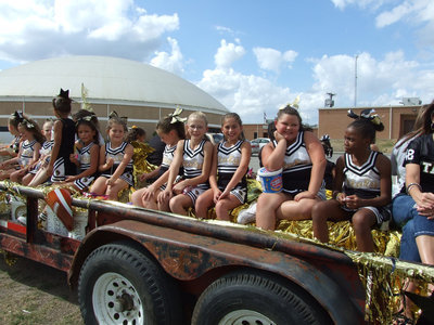 Image: IYAA cheerleaders ride in the Homecoming parade.