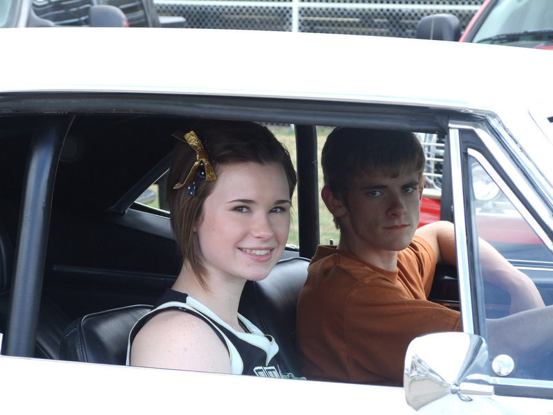 Image: Megann Hooker and Justin Wood take their spot in the parade.