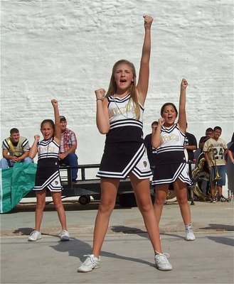 Image: IYAA A-Team cheerleaders Caitlin Oldfield, Annie Perry and Caroline Pittman pump up Gladiator fans during the IHS Homecoming Pep Rally.