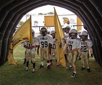 Image: IYAA C-Team Gladiators get ready to bust out of the tunnel at Willis Field and wave the Italy Gladiator flags. Next time we have to remember to tell them were to go and when to stop.