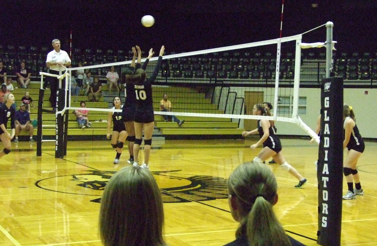 Image: Gladiator JV serves the ball to Grandview