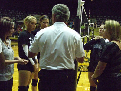 Image: Megan Richards and Kaitlyn Rossa meet the Grandview captains with the referee.