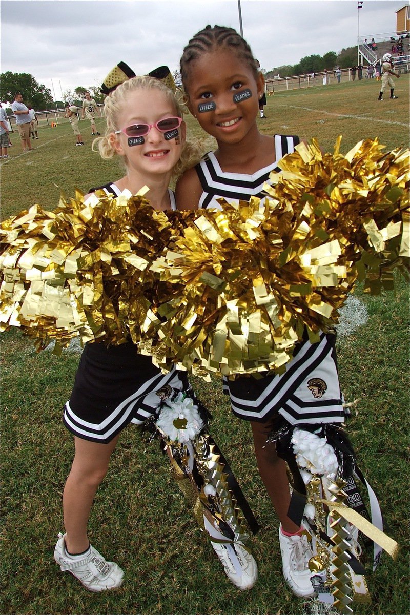 Image: B-Team cheerleaders Courtney Riddle and Destiny Harris show off their homecoming bling.
