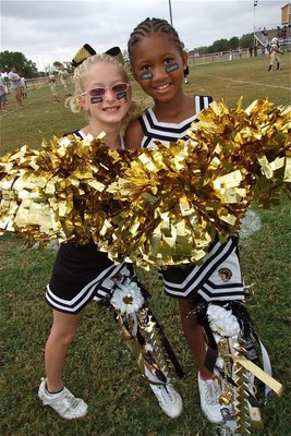 Image: B-Team cheerleaders Courtney Riddle and Destiny Harris show off their homecoming bling.