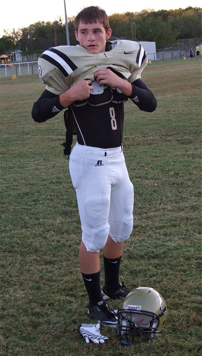 Image: Cornerback Hayden Woods(8) gets buckled before taking on the Bison at Willis Field in Italy.