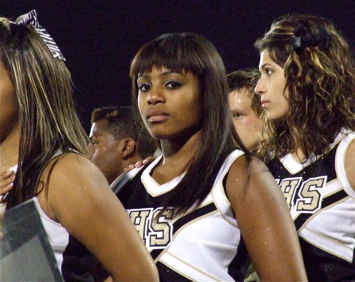 Image: IHS cheerleaders Ashley Harper and Beverly Barnhart have the Gladiators’ back.