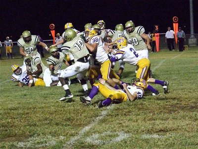 Image: The Buffalo Bison defense had a tough time keeping Italy’s Ryheem Walker(10) out of the endzone.