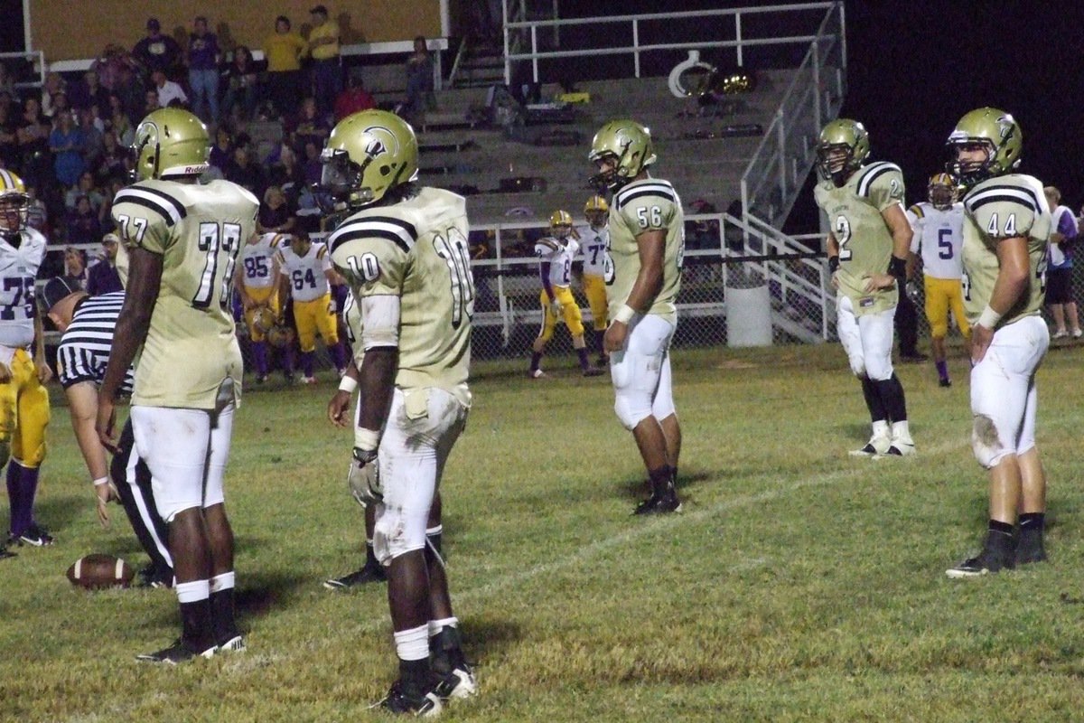 Image: Gladiator defenders Larry Mayberry, Jr.(77), Ryheem Walker(10), Omar Estrada(56), Chase Hamilton(2) and Ethan Saxon(44) get set for the next play.