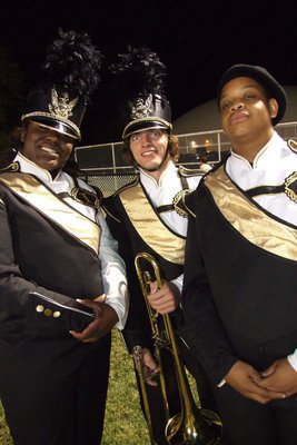 Image: Band members Jimesha Reed, Zach Latimer and Timothy Fleming are really excited about performing at halftime.