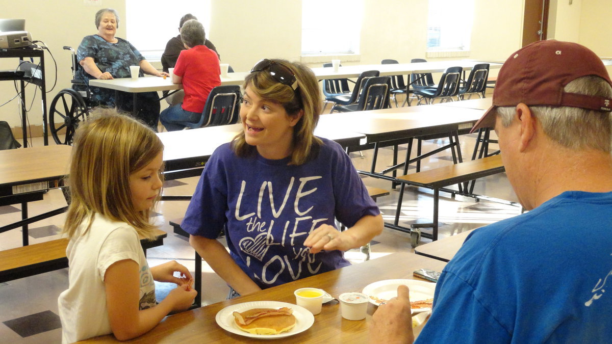 Image: The Snook family prepares for breakfast.