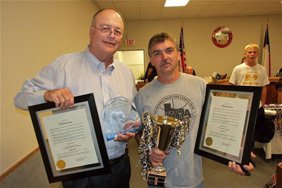 Image: “Citizen of the Year,” Mark Stiles and “IYAA Volunteer of the Year,” Gary Wood, display their IYAA Day proclamation plaques and trophies.