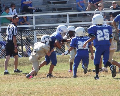 Image: Bryce DeBorde(4) and Jayden Barr(10) move in a Lion runner during the B-Team game.
