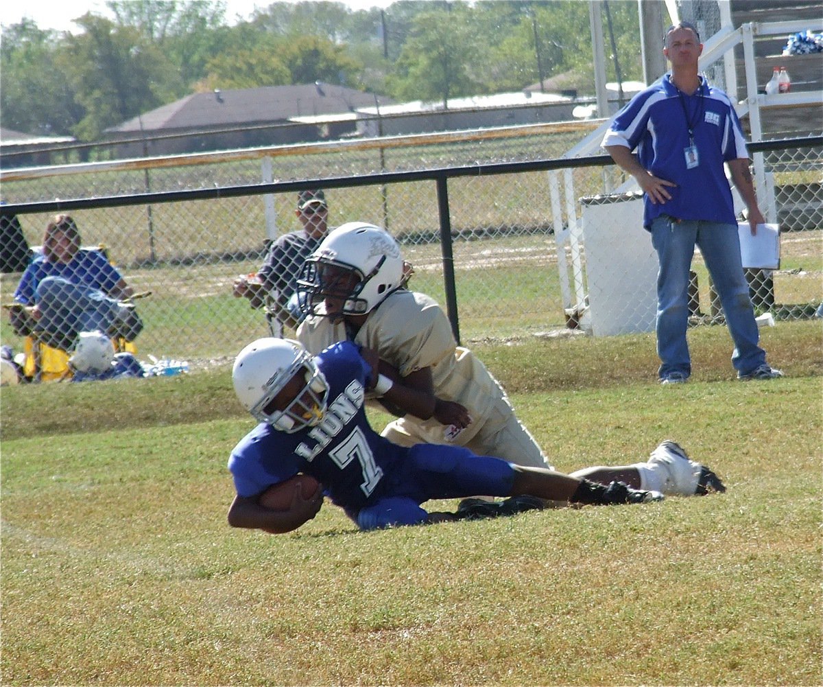 Image: B-Team Gladiator Ricky Pendleton(21) sacks the Lions for a huge loss.