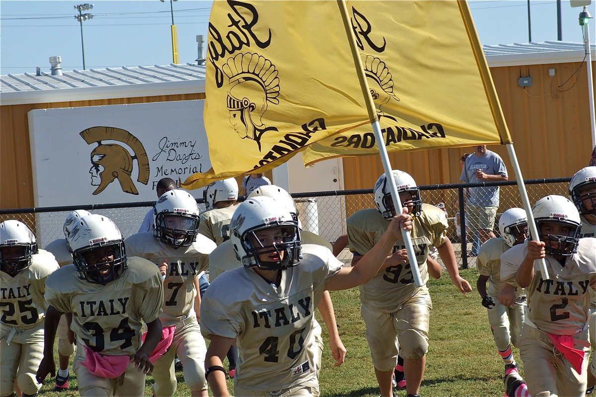 Image: Here come the IYAA A-Team Gladiators with flags raised and hungry for Lions.