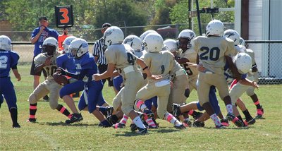 Image: A-Team Gladiators Kendrick Norwood(10) and Gary Sott(40) lead an assault on the Lion backfield.