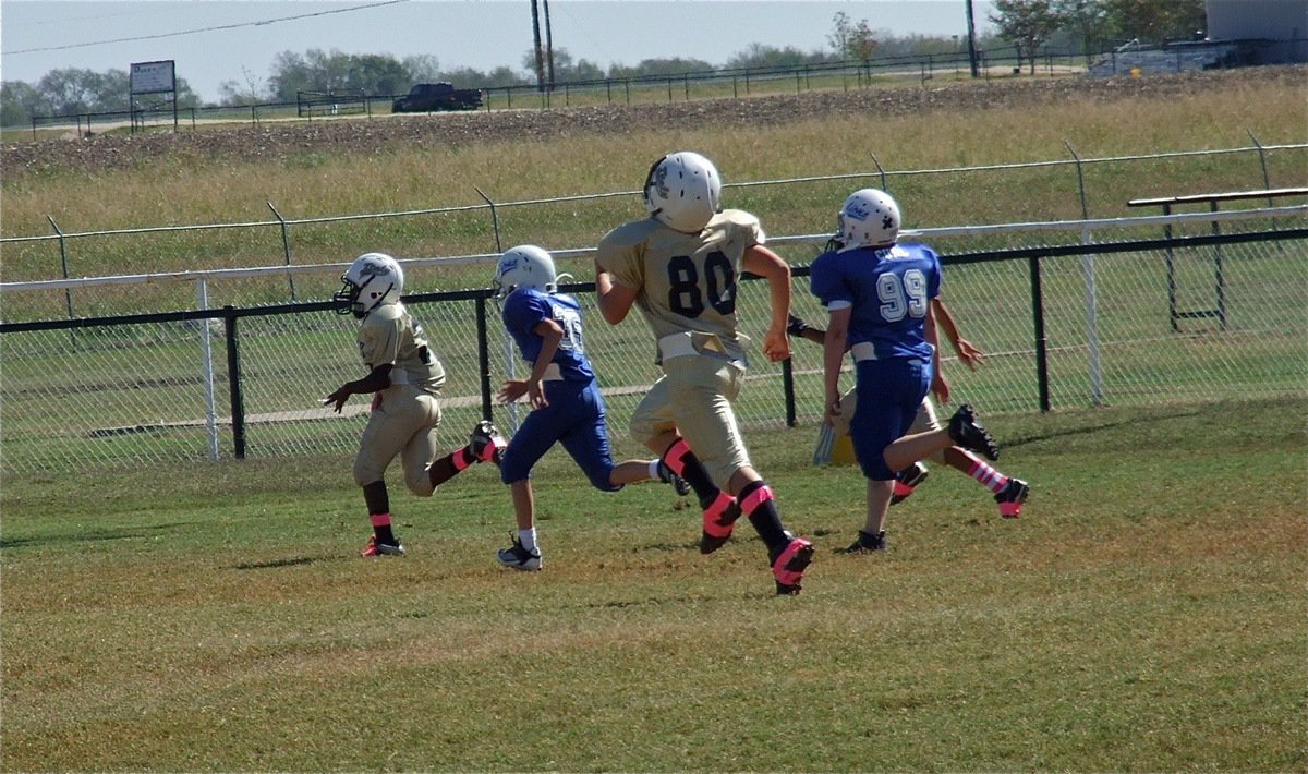 Image: Taron Smith(34) goes the distance for an IYAA A-Team touchdown.