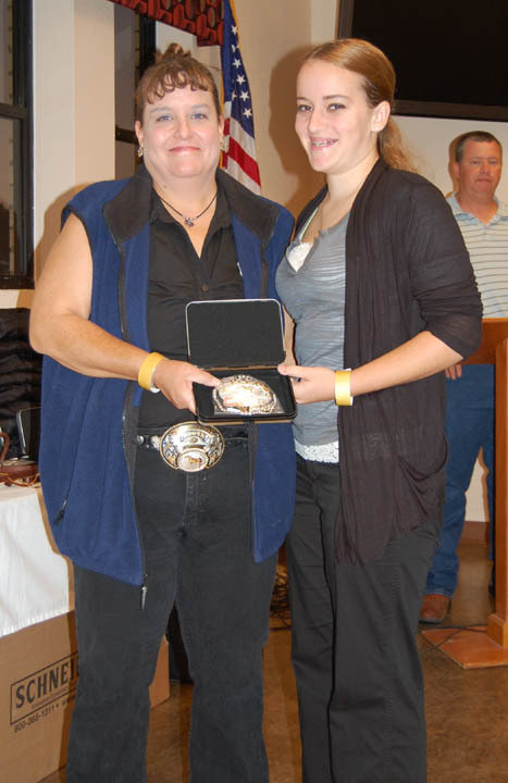 Image: ECEA Vice President Becky Hansen, left, presents Elizabeth Terry of Waxahachie with the Champion Junior Halter Gelding buckle. The horse and exhibitor team also earned awards as Reserve Champion Green Horse and Top 5 Western and Top 5 English riders in the 14 to 18 age division.