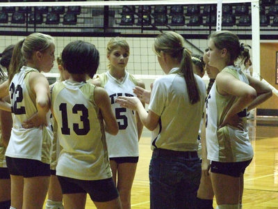 Image: Coach Reeves tells the Lady Gladiators about their defense.
