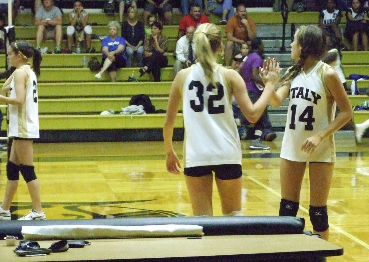 Image: Jozie and Hannah switch places.  It’s time to serve.