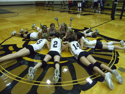 Image: The 8th grade volleyball team finishes the season with a happy winner’s circle when they defeated the Lady Wildcats from Whitney.
