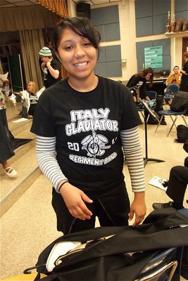 Image: Julissa Hernandez gets her band uniform packed for the competition.