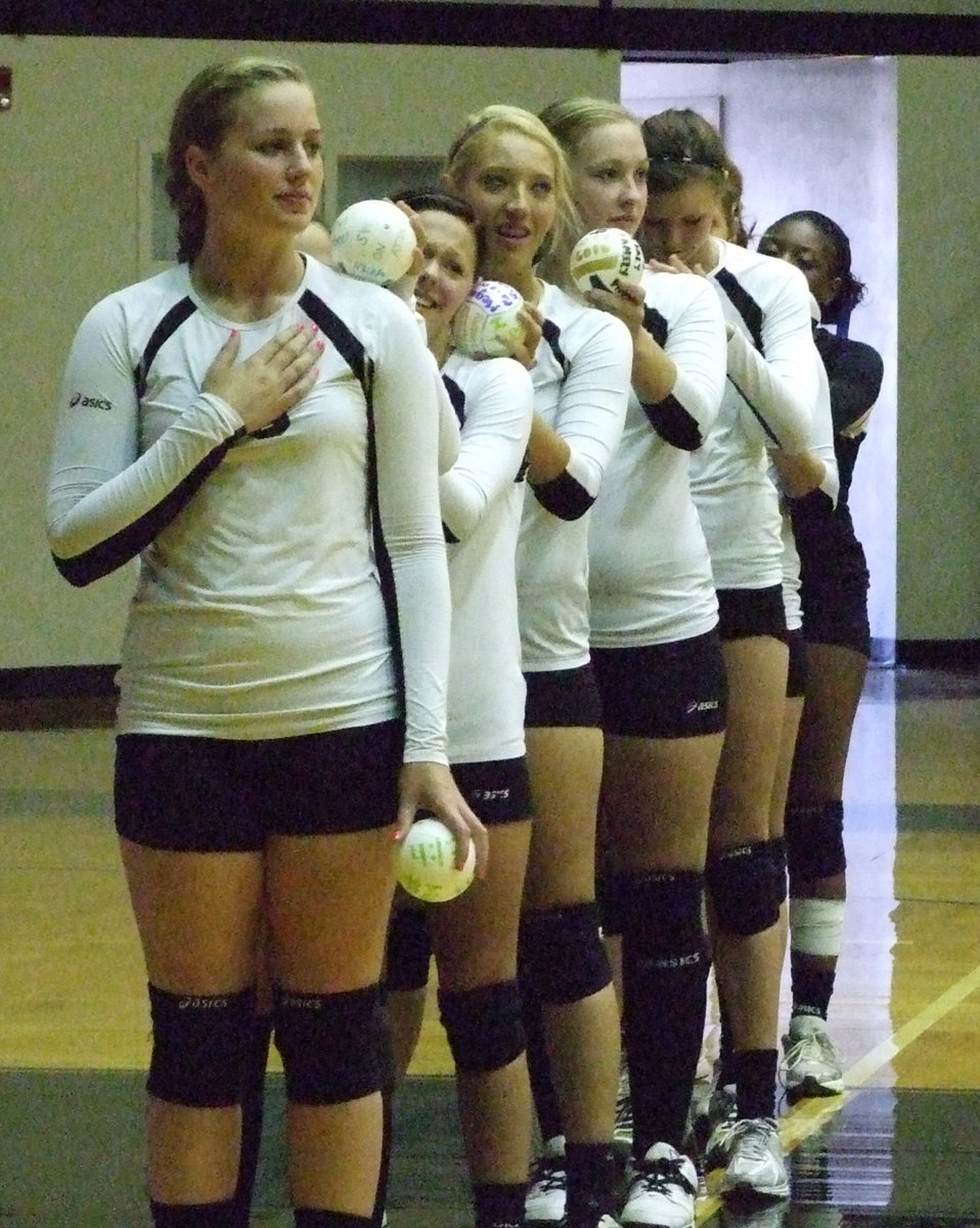 Image: The Lady Gladiators stand at attention during the “Star Spangled Banner”.