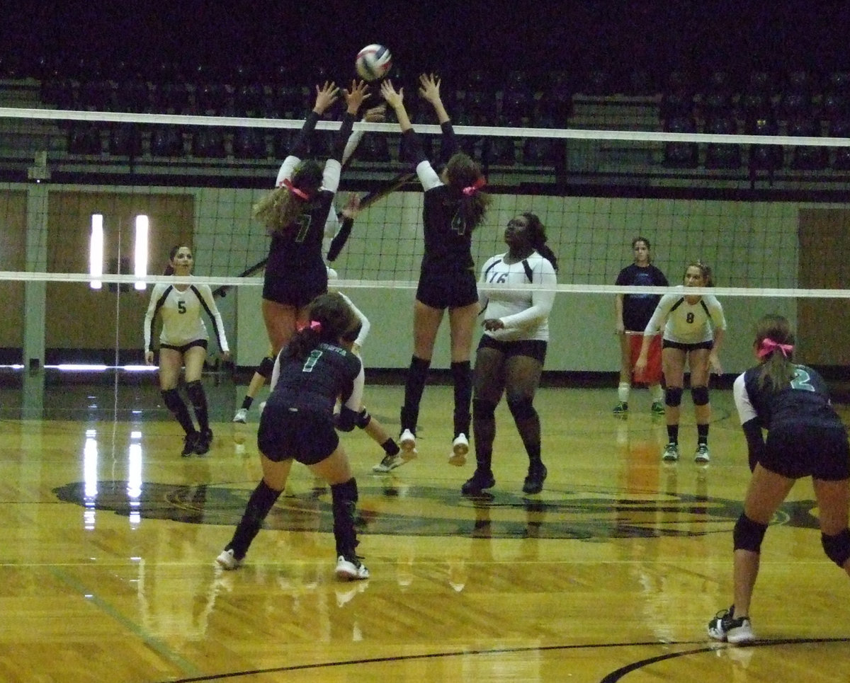 Image: The Lady Eagles try to defend their net but to no avail.