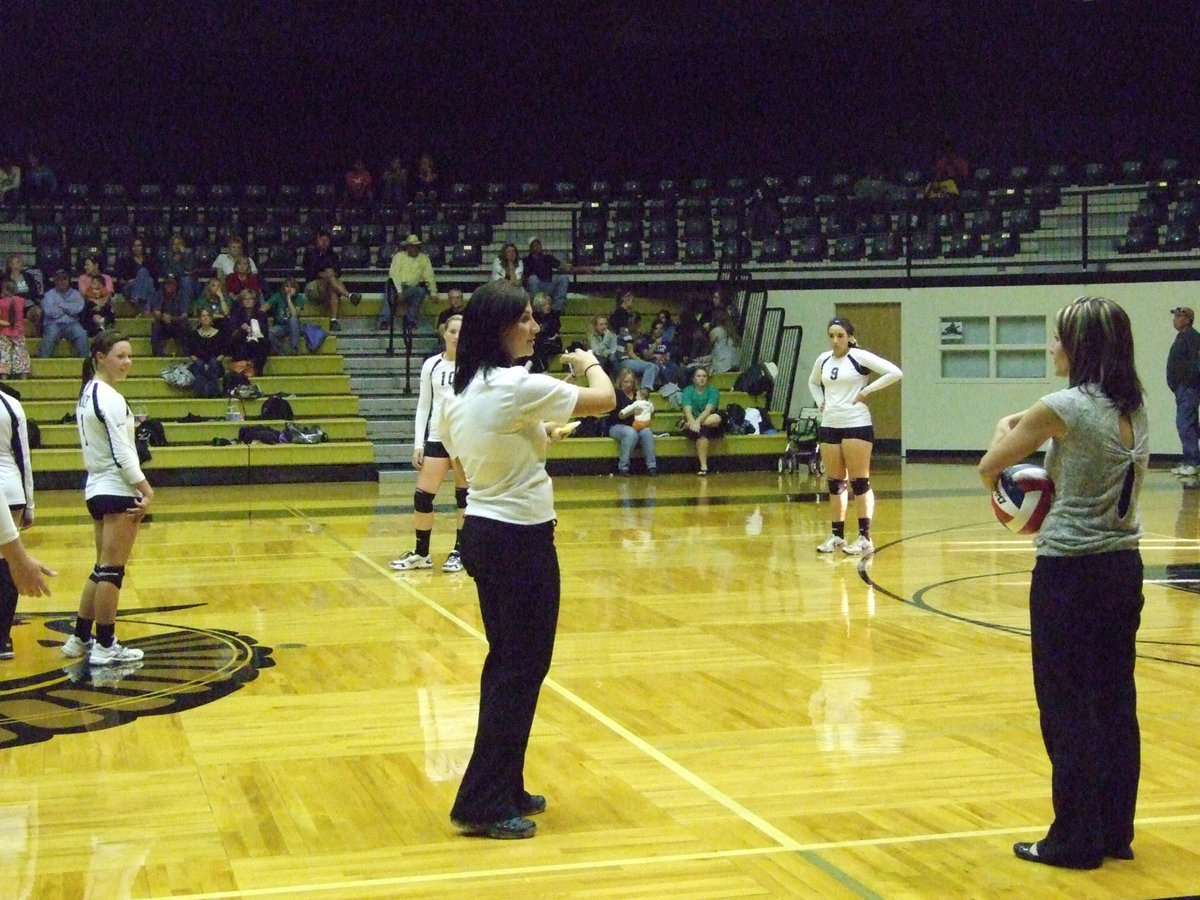 Image: One of the referees confers with Coach Richters about the Lady Gladiators’ rotation.