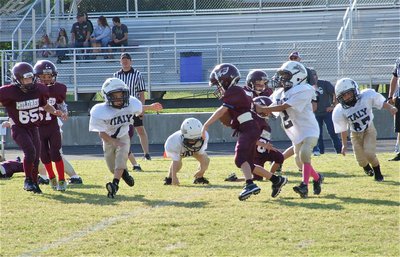 Image: Jaylon Wallace(2) and David Martinez(1) keep this Eagle runner grounded.