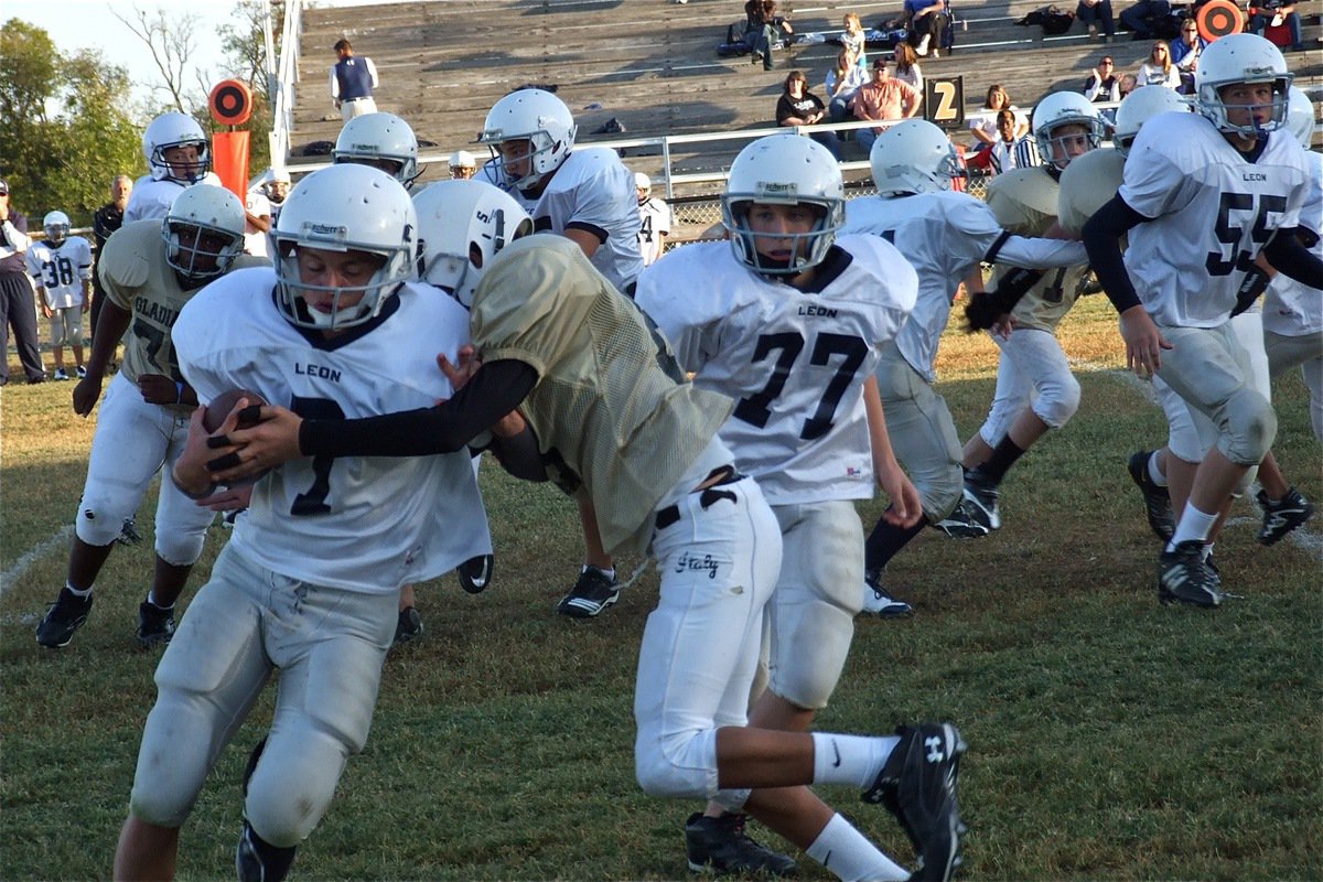 Image: Mason Womack(88) brings down a Cougar to foil Leon’s sweep.