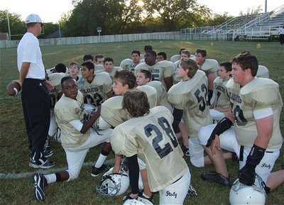 Image: Coach Aidan Callahan talks with the Jr. High Gladiators after the game.