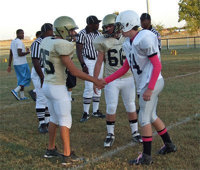 Image: JV Gladiator captains Chace McGinnis(85) and Kyle Fortenberry(66) wish the Leon captain and his team good luck.